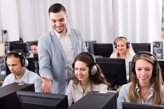 male talking to woman with a headset