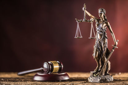 lady justice statue beside a gavel