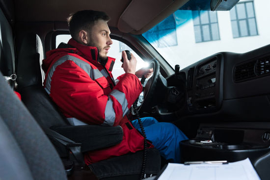 male on handheld radio