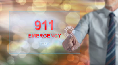 words 911 emergency with man pointing at them 